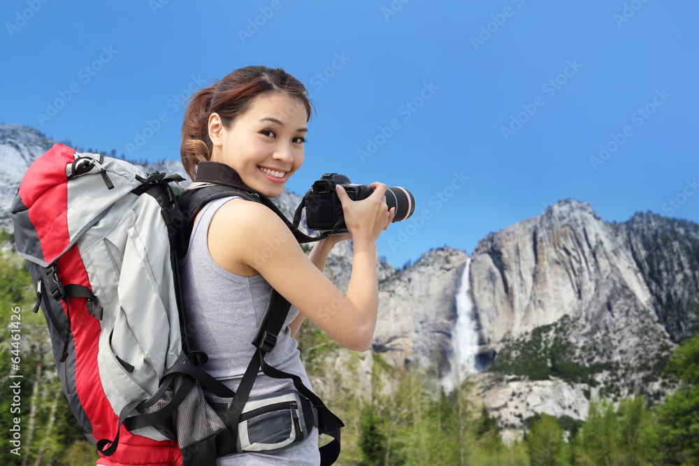 Poster woman mountain hiker taking pictures in yosemite