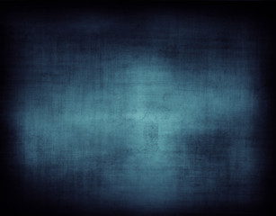 Blue abstract textured background. Dark edges. Copy space