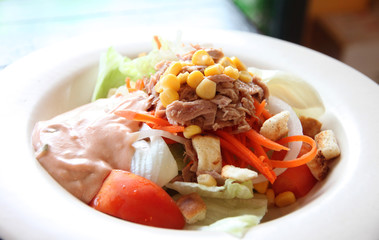tuna and vegetable salad in dish.