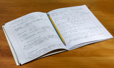 Notebook with pencil.