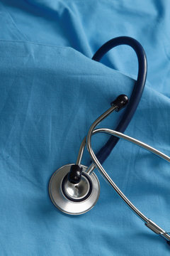 A stethoscope on a medical uniform, closeup.