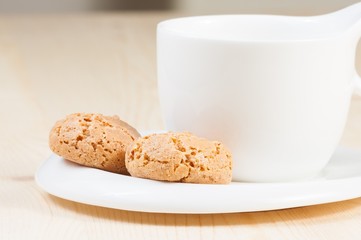 cup of espresso coffee near biscuit