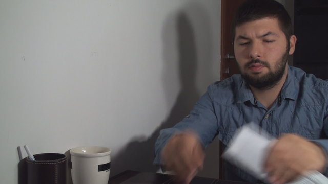 Business Man Folding A Paper And Putting It In An Envelope