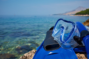 Mask and flippers on the beach