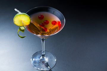 Cocktail with whisky and raspberry sphere