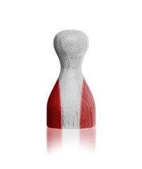 Wooden pawn with a flag painting