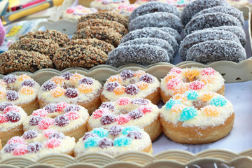 A lot of donuts and strawberry jam