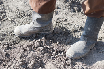 Boots on dry earth.
