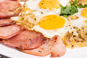 Breakfast with fried eggs beacon and onion