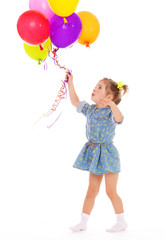 Fototapeta na wymiar Charming girl with balloons.