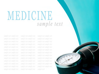 Sphygmomanometer on blue, reflective background
