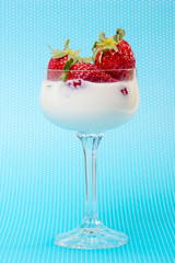 fresh strawberries on a glass with cream
