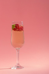 fresh strawberry on a glass with champagne