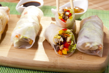 Portion of spring rolls on a bamboo board