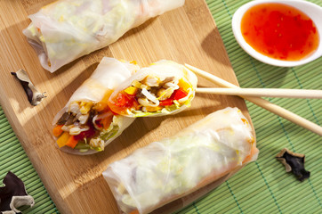 Portion of spring rolls on a bamboo board
