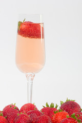 fresh strawberry on a glass with wine