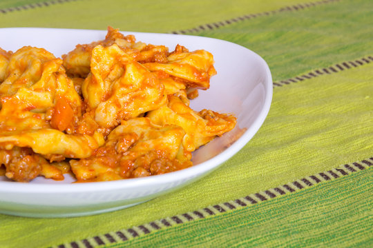Cappellacci with rag&ugrave; pasta stuffed with pumpkin