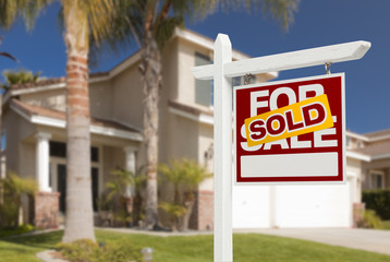 Sold Home For Sale Sign in Front of New House - obrazy, fototapety, plakaty