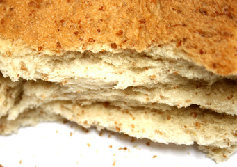 slice of bread with crumbs; isolated; white background