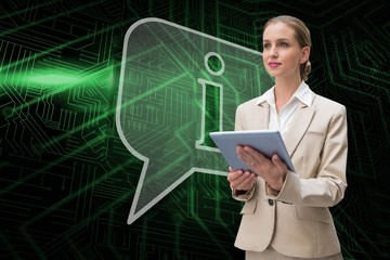 Composite image of speech bubble and businesswoman using tablet