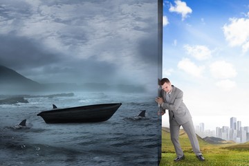 Obraz premium Composite image of businessman pushing away scene