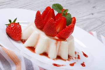 beautiful delicious dessert panna cotta with fresh strawberries