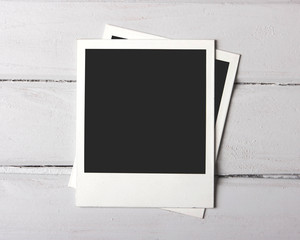 Instant photos on white plank