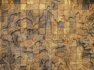 Fototapeta na wymiar Carved wall sculpture in the temple of thailand