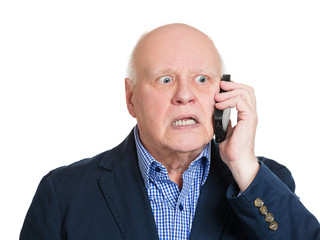 Bad news phone call. Senior man has unpleasant conversation