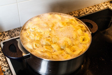 pasta tortellini cooking in pot