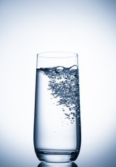 water glass on blue background