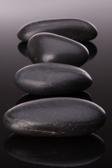 Spa stone arrangement on black surface