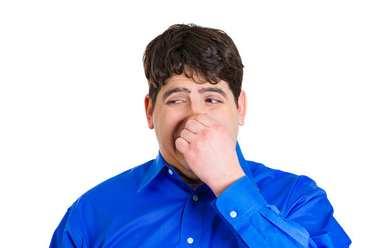 Man pinching his nose, bad smell, odor, situation