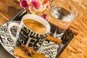 cup of fresh espresso with water