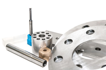 Metal flanges, mill and brass nuts. Metalworking, lathe, drill