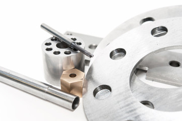 Metal flanges, mill and brass nuts. Metalworking, lathe, cnc