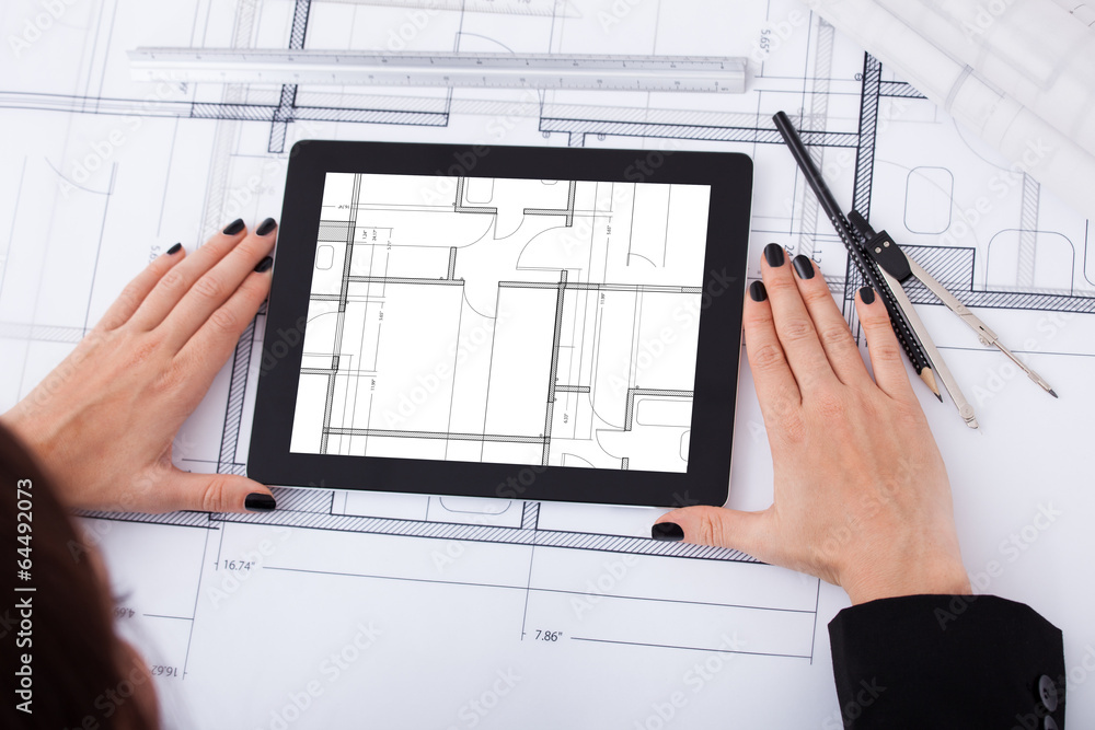 Poster architect with digital tablet and blueprint