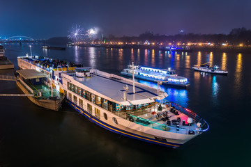 Passenger Boat with Fireworks in Background - obrazy, fototapety, plakaty