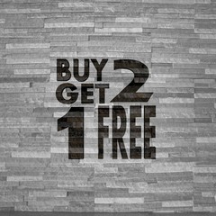 buy two get one free label  on noble stone texture