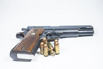 11 mm. Black handgun And ammunition