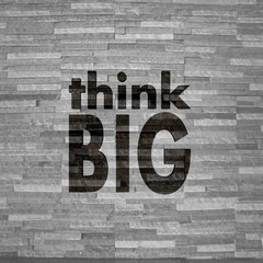 think big sign  on noble stone texture
