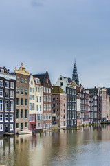 Fototapeta na wymiar The Damrak canal in Amsterdam, Netherlands.