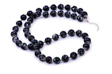 Dark pearl necklace isolated on the white