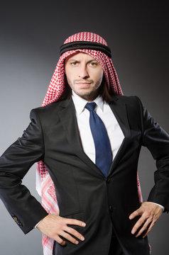 Arab businesssman against grey background