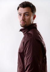 Obraz premium Portrait of handsome young man, on gray background