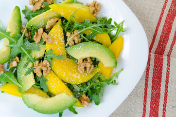 Exotic fruit salad food with mango, avocado, rucola