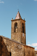 Tower of an ancient fortress with a flag.