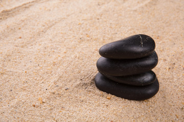 Fototapeta na wymiar Beach Sand And Zen Stone
