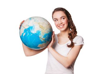 pretty smiling young lady holding a world globe. isolated on