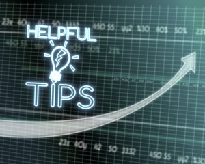 Obraz premium helpful tips icon on stock market graph